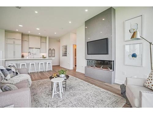 806-2750 King Street E, Hamilton, ON - Indoor Photo Showing Living Room With Fireplace