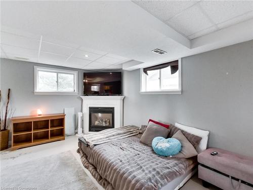 15 Gissing Street, Princeton, ON - Indoor Photo Showing Bedroom With Fireplace