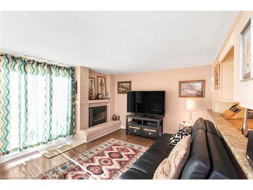 2-2052 Brant Street, Burlington, ON - Indoor Photo Showing Living Room With Fireplace