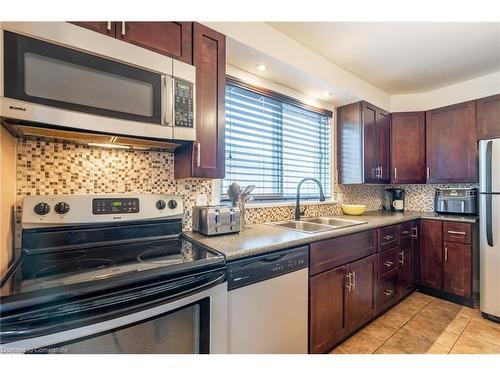 702 Seventh Avenue, Hamilton, ON - Indoor Photo Showing Kitchen With Double Sink