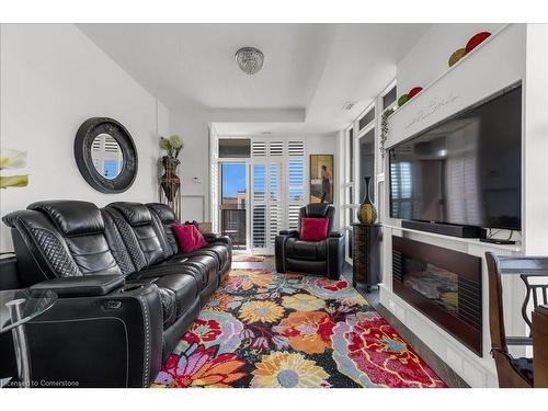 309-10 Concord Place, Grimsby, ON - Indoor Photo Showing Living Room With Fireplace