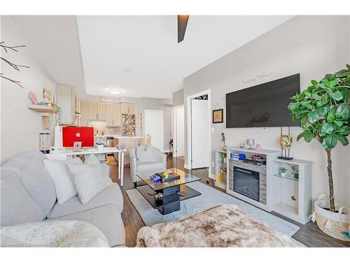 408-2093 Fairview Street, Burlington, ON - Indoor Photo Showing Living Room With Fireplace