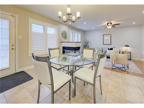 129 Dorchester Drive, Grimsby, ON - Indoor Photo Showing Dining Room With Fireplace