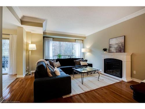 306-2000 Creekside Drive, Dundas, ON - Indoor Photo Showing Living Room With Fireplace