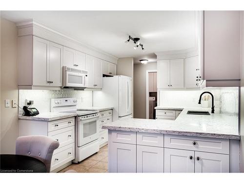 306-2000 Creekside Drive, Dundas, ON - Indoor Photo Showing Kitchen With Double Sink