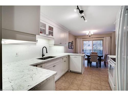 306-2000 Creekside Drive, Dundas, ON - Indoor Photo Showing Kitchen With Double Sink