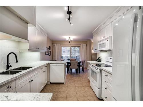 306-2000 Creekside Drive, Dundas, ON - Indoor Photo Showing Kitchen With Double Sink