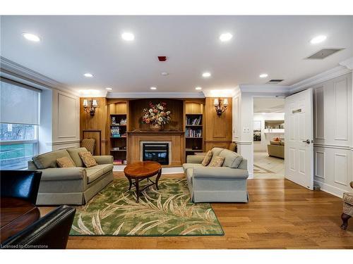 306-2000 Creekside Drive, Dundas, ON - Indoor Photo Showing Living Room With Fireplace