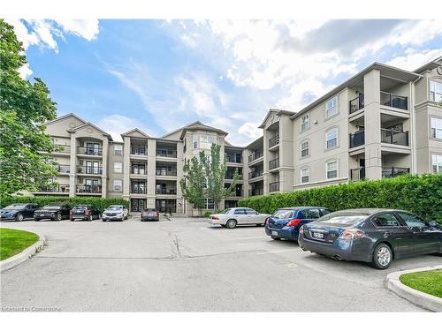 210-2055 Appleby Line, Burlington, ON - Outdoor With Balcony With Facade