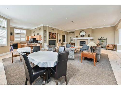 210-2055 Appleby Line, Burlington, ON - Indoor Photo Showing Living Room With Fireplace