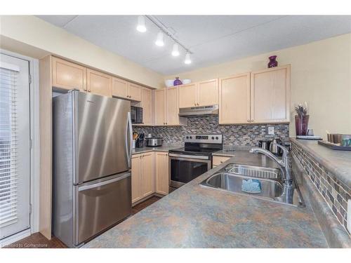 216-1411 Walker'S Line, Burlington, ON - Indoor Photo Showing Kitchen With Double Sink