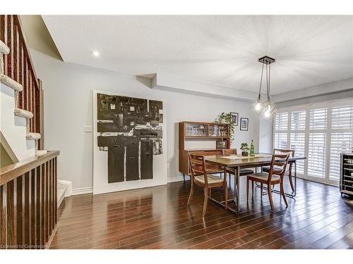 18-362 Plains Road E, Burlington, ON - Indoor Photo Showing Dining Room With Fireplace