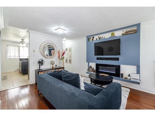 2-55 Blandford Street, Woodstock, ON - Indoor Photo Showing Living Room With Fireplace