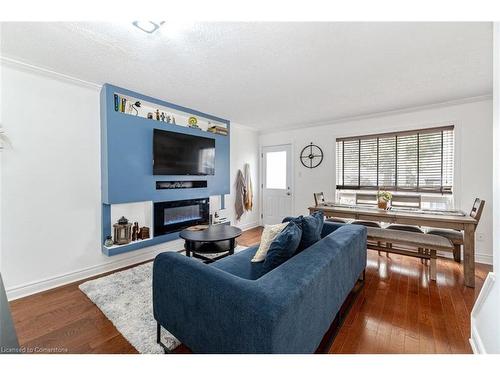 2-55 Blandford Street, Woodstock, ON - Indoor Photo Showing Living Room With Fireplace