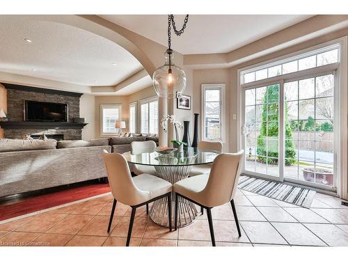 2514 Nicklaus Court, Burlington, ON - Indoor Photo Showing Dining Room With Fireplace