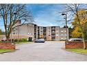 402-10 John Street, Grimsby, ON  - Outdoor With Balcony With Facade 