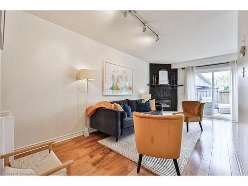 110-3333 New Street, Burlington, ON - Indoor Photo Showing Other Room With Fireplace