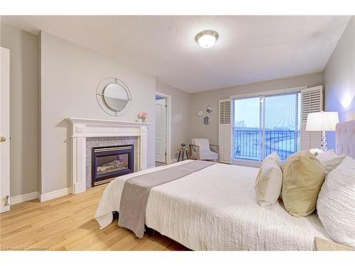 487 Dewitt Road, Stoney Creek, ON - Indoor Photo Showing Bedroom With Fireplace