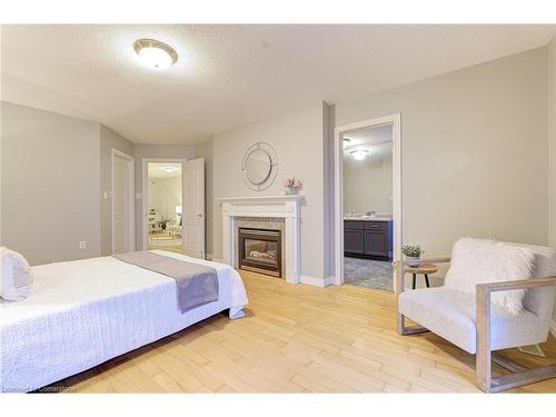 487 Dewitt Road, Stoney Creek, ON - Indoor Photo Showing Bedroom With Fireplace