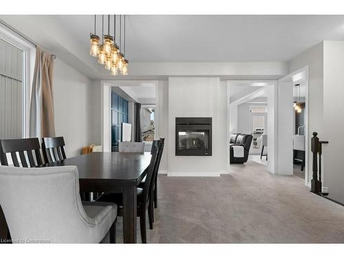 119 Brigham Avenue, Binbrook, ON - Indoor Photo Showing Dining Room With Fireplace