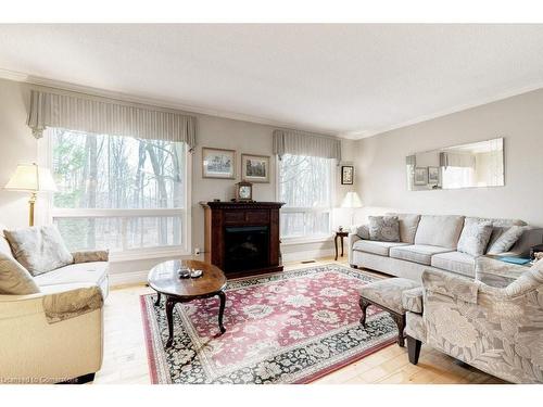 41-2301 Cavendish Drive, Burlington, ON - Indoor Photo Showing Living Room With Fireplace