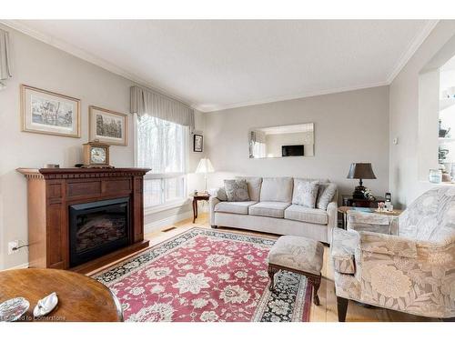 41-2301 Cavendish Drive, Burlington, ON - Indoor Photo Showing Living Room With Fireplace