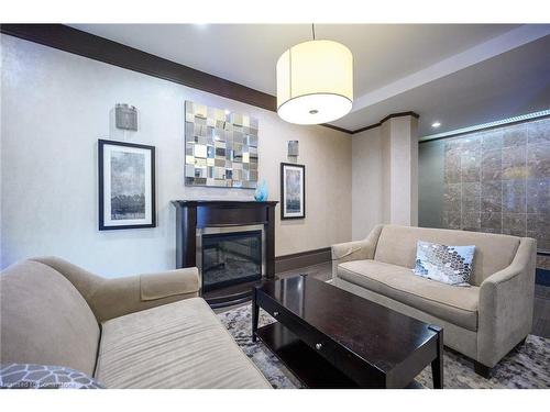 1801-67 Caroline Street S, Hamilton, ON - Indoor Photo Showing Living Room With Fireplace