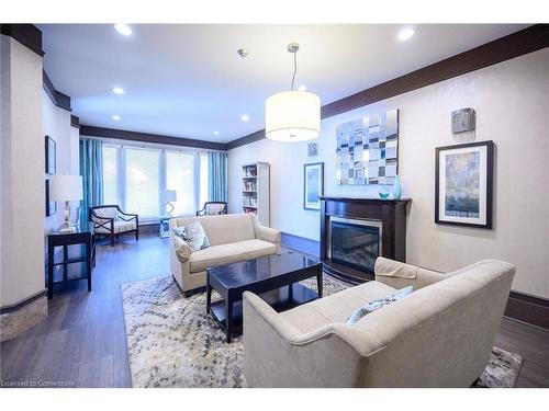 1801-67 Caroline Street S, Hamilton, ON - Indoor Photo Showing Living Room With Fireplace