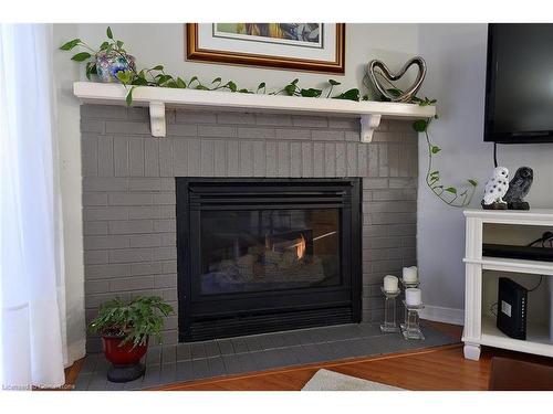 102-2055 Walkers Line, Burlington, ON - Indoor Photo Showing Living Room With Fireplace