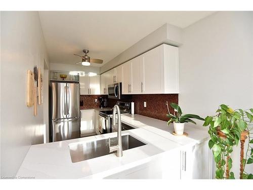 102-2055 Walkers Line, Burlington, ON - Indoor Photo Showing Kitchen With Stainless Steel Kitchen With Double Sink With Upgraded Kitchen