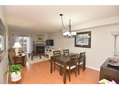 102-2055 Walkers Line, Burlington, ON - Indoor Photo Showing Dining Room With Fireplace