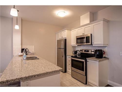 919-118 King Street E, Hamilton, ON - Indoor Photo Showing Kitchen With Double Sink