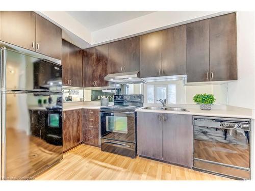 118-3050 Erin Centre Boulevard, Mississauga, ON - Indoor Photo Showing Kitchen With Double Sink