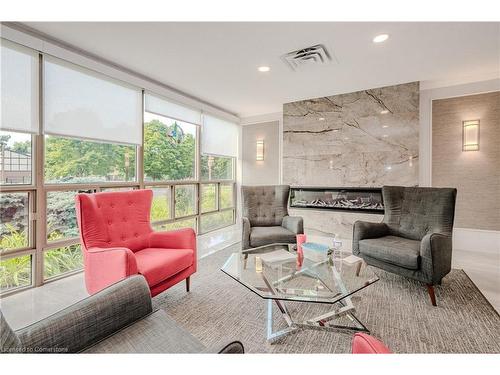 503-5090 Pinedale Avenue, Burlington, ON - Indoor Photo Showing Living Room With Fireplace