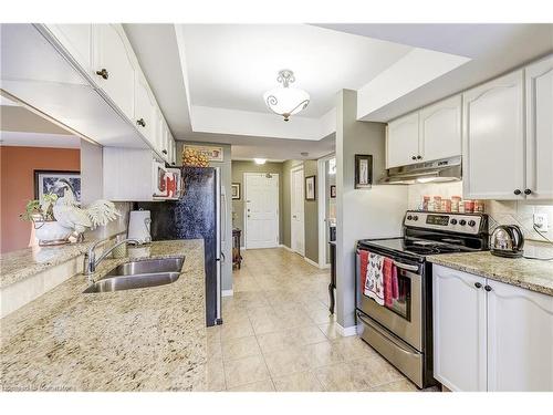 A402-216 Plains Road W, Burlington, ON - Indoor Photo Showing Kitchen With Double Sink