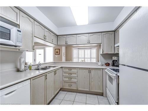 A402-216 Plains Road W, Burlington, ON - Indoor Photo Showing Kitchen With Double Sink