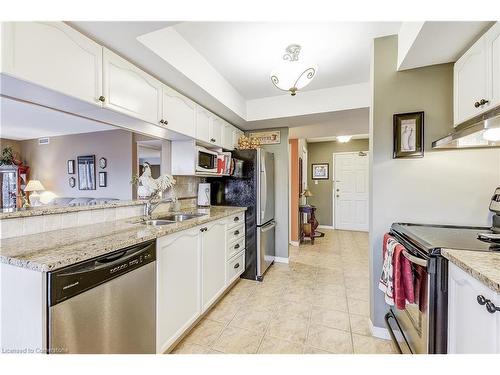 A402-216 Plains Road W, Burlington, ON - Indoor Photo Showing Kitchen With Double Sink