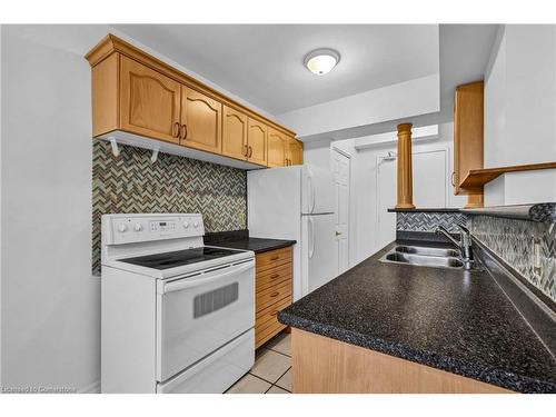 607-851 Queenston Road, Stoney Creek, ON - Indoor Photo Showing Kitchen With Double Sink