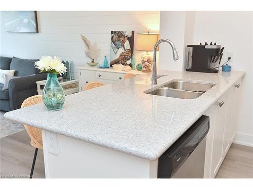 707-450 Dundas Street E, Waterdown, ON - Indoor Photo Showing Kitchen With Double Sink