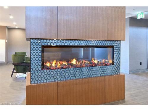 707-450 Dundas Street E, Waterdown, ON - Indoor Photo Showing Living Room With Fireplace