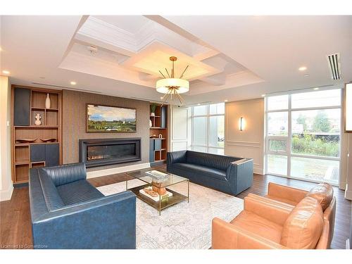 707-450 Dundas Street E, Waterdown, ON - Indoor Photo Showing Living Room With Fireplace