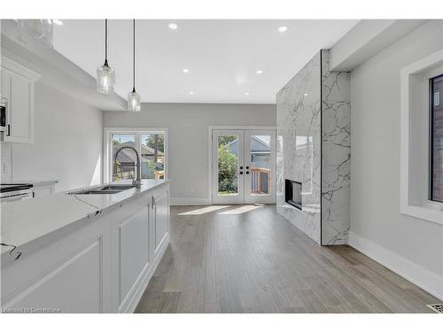 86 Beland Avenue N, Hamilton, ON - Indoor Photo Showing Kitchen With Fireplace With Upgraded Kitchen