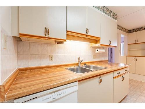 604-11 Mill Pond Court, Simcoe, ON - Indoor Photo Showing Kitchen With Double Sink