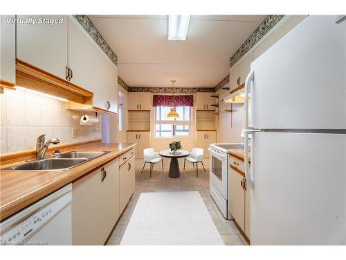 604-11 Mill Pond Court, Simcoe, ON - Indoor Photo Showing Kitchen With Double Sink