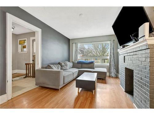 110 Paling Avenue, Hamilton, ON - Indoor Photo Showing Living Room With Fireplace