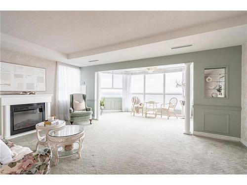 911-5280 Lakeshore Road, Burlington, ON - Indoor Photo Showing Living Room With Fireplace