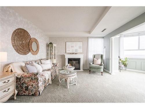 911-5280 Lakeshore Road, Burlington, ON - Indoor Photo Showing Living Room With Fireplace