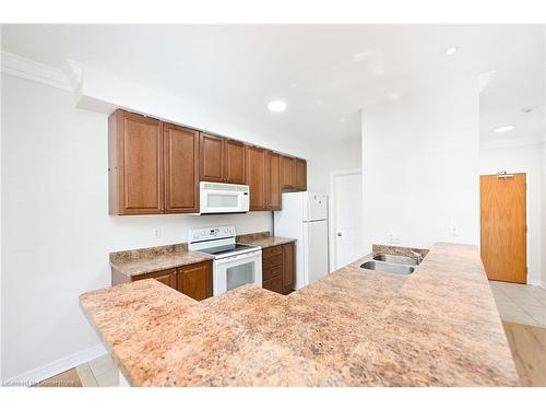 213-443 Centennial Forest Drive, Milton, ON - Indoor Photo Showing Kitchen With Double Sink