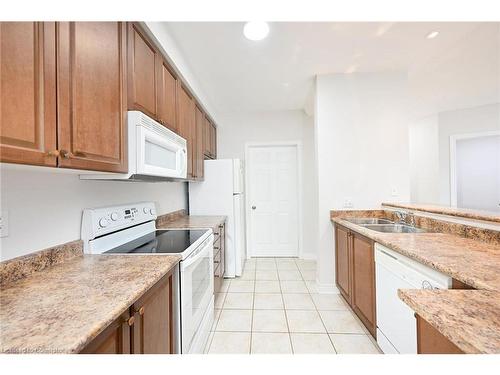 213-443 Centennial Forest Drive, Milton, ON - Indoor Photo Showing Kitchen With Double Sink