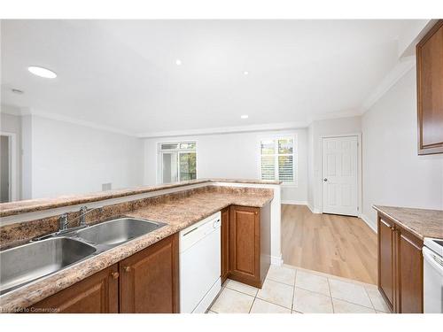 213-443 Centennial Forest Drive, Milton, ON - Indoor Photo Showing Kitchen With Double Sink